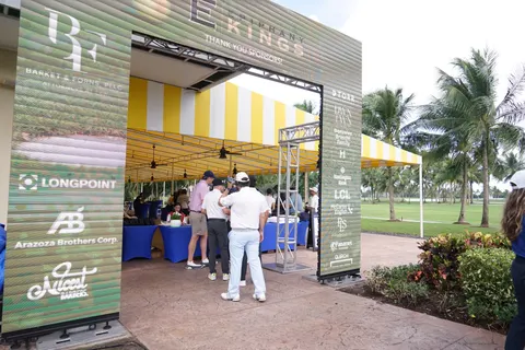A sponsor-branded entrance frames the tournament gathering.